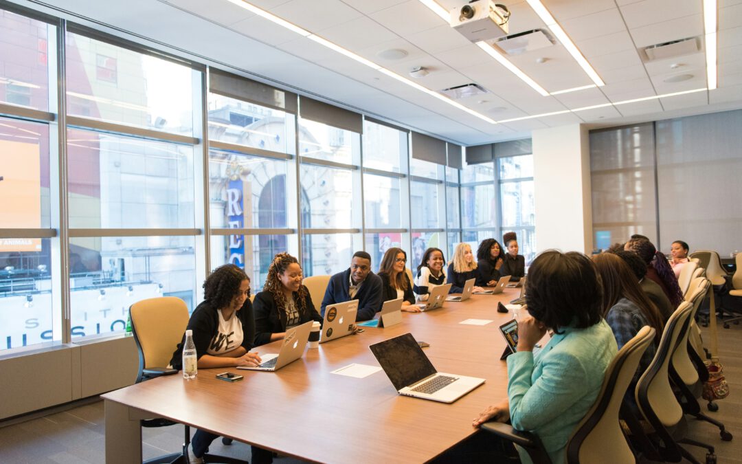 People sitting at a meeting table in a conference room