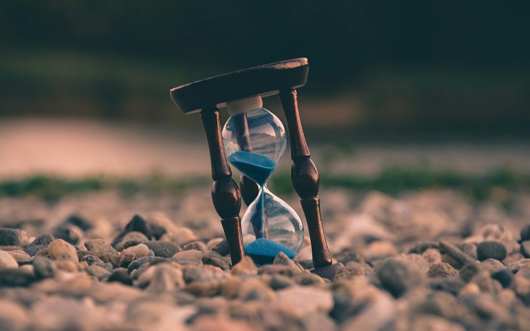 Sandglass with blue sand